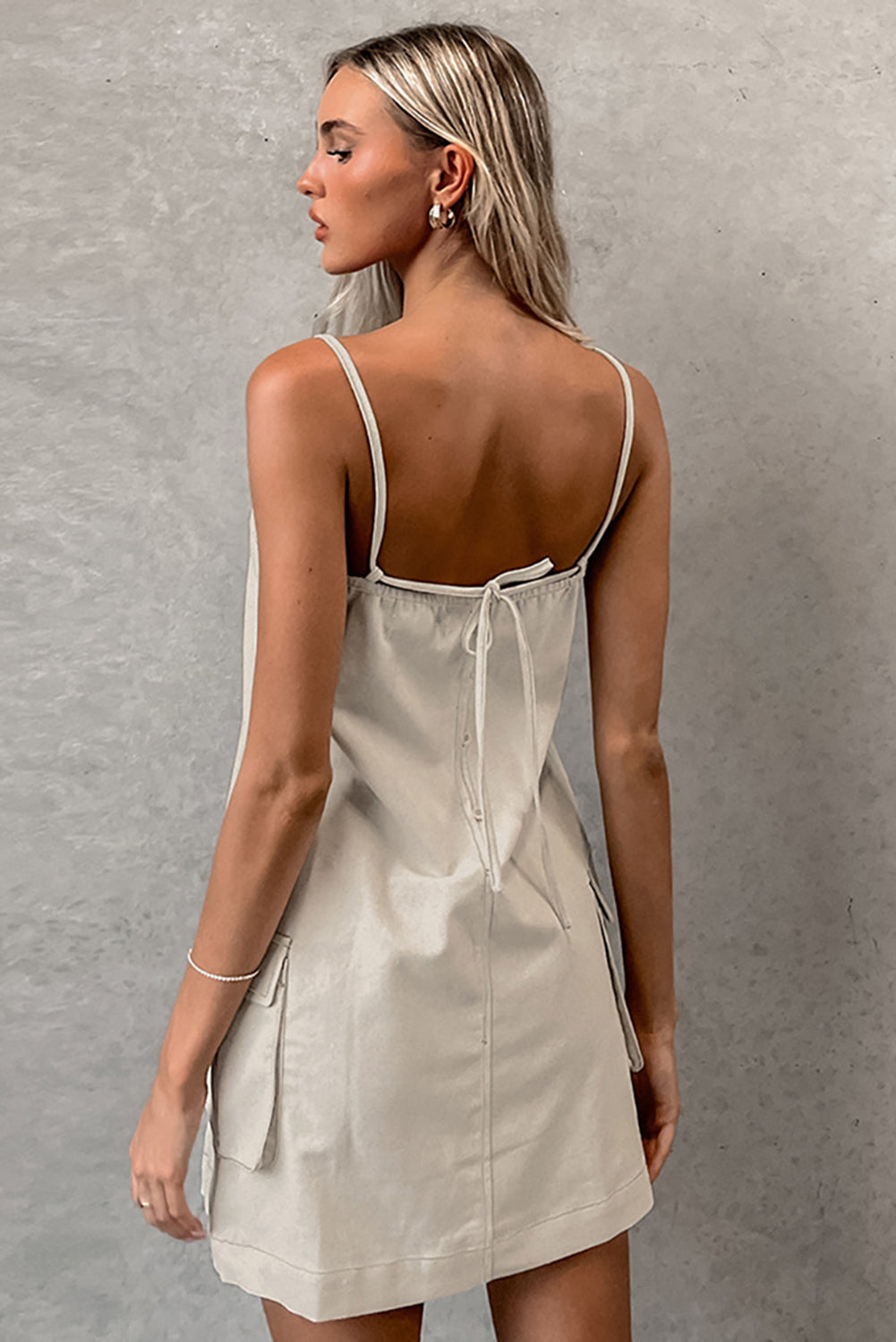 Parchment Minimalist Pocketed Sleeveless Backless Short Dress